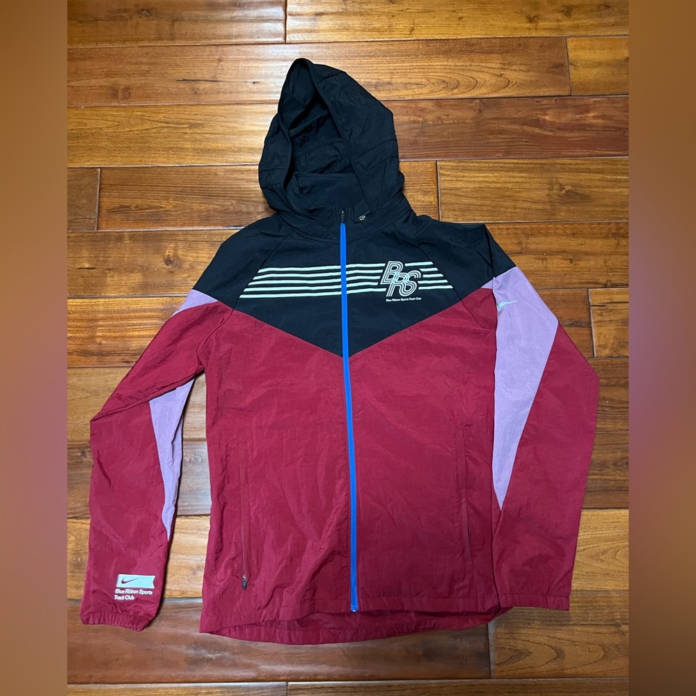 New never worn without tags Nike blue ribbon sports track club jacket size small